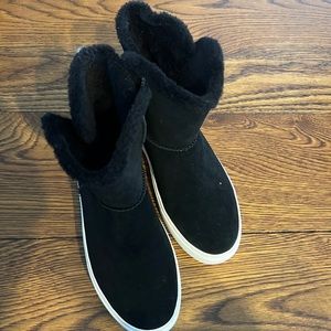 Black Ugg boots with white bottom, shearling inside